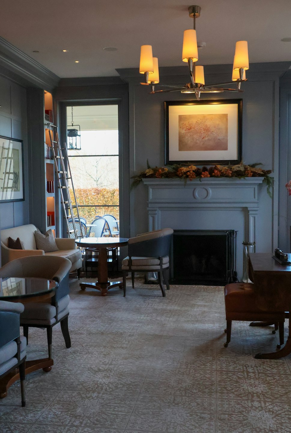 Sophisticated lounge featuring a fireplace decorated for the autumn season.