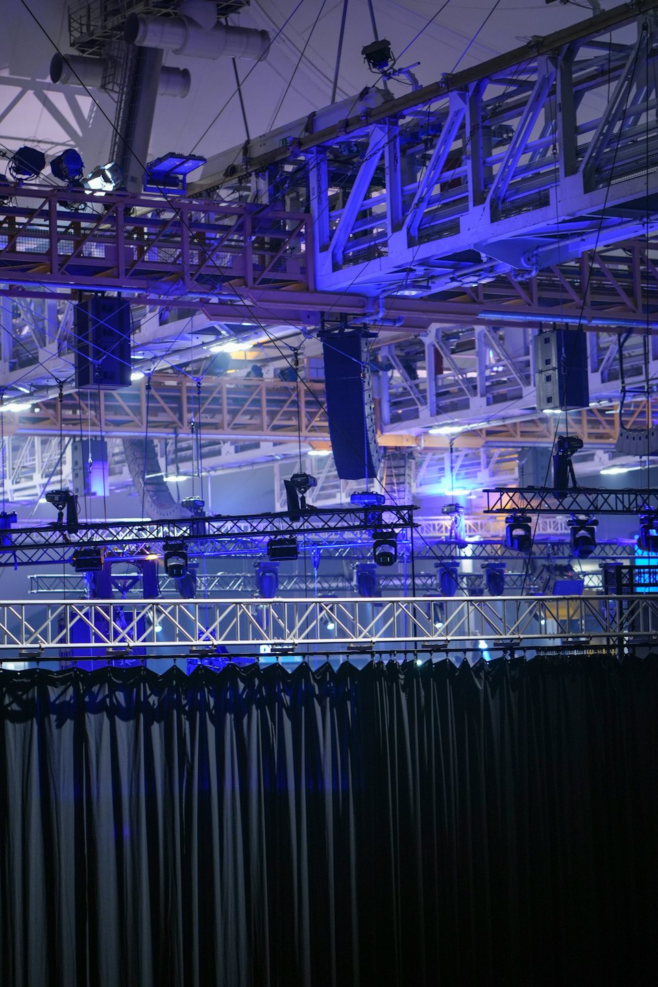 Stage equipment with metal trusses, speakers, and lighting.